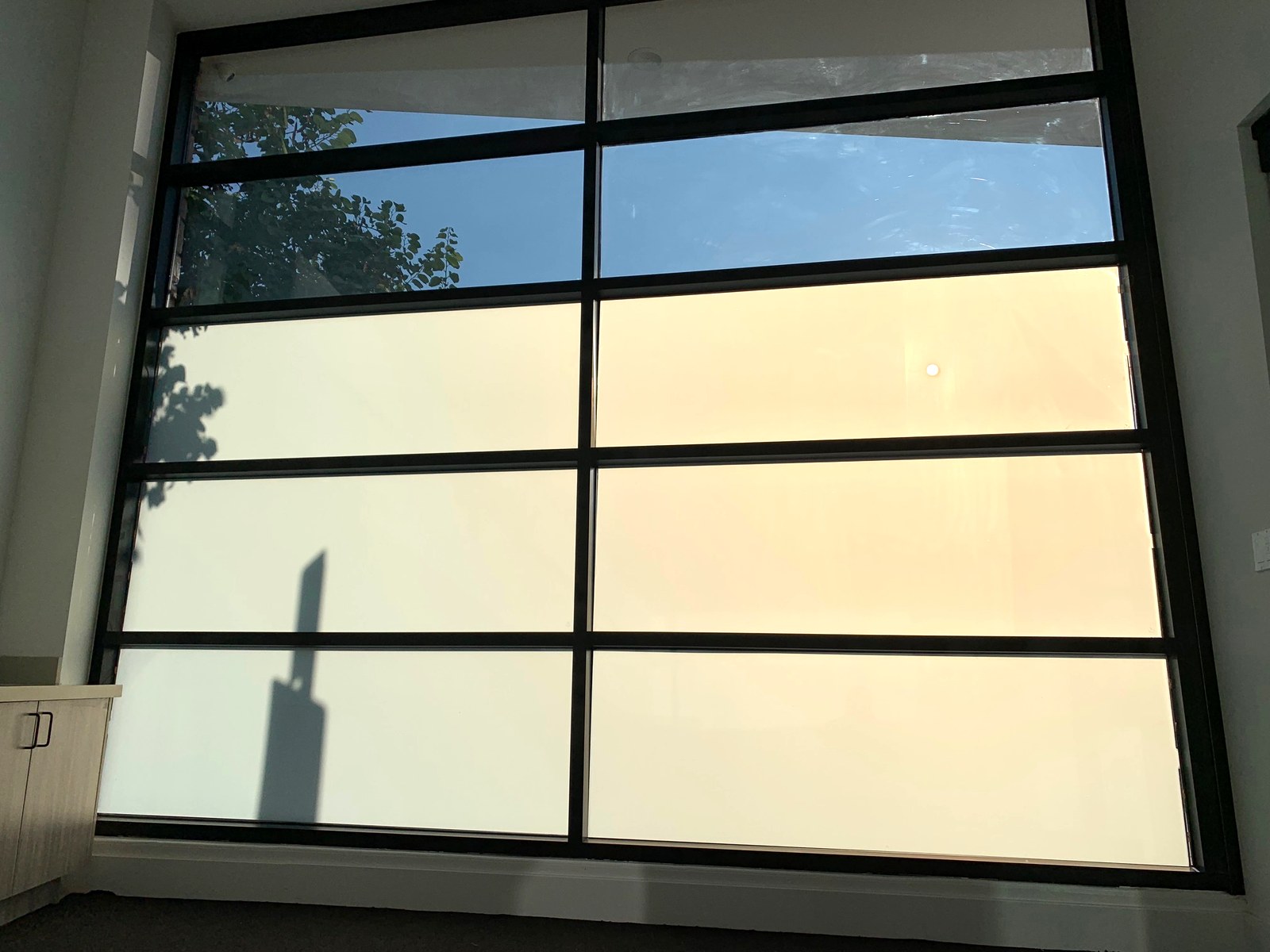 The same smart film switched to private — opaque white panels