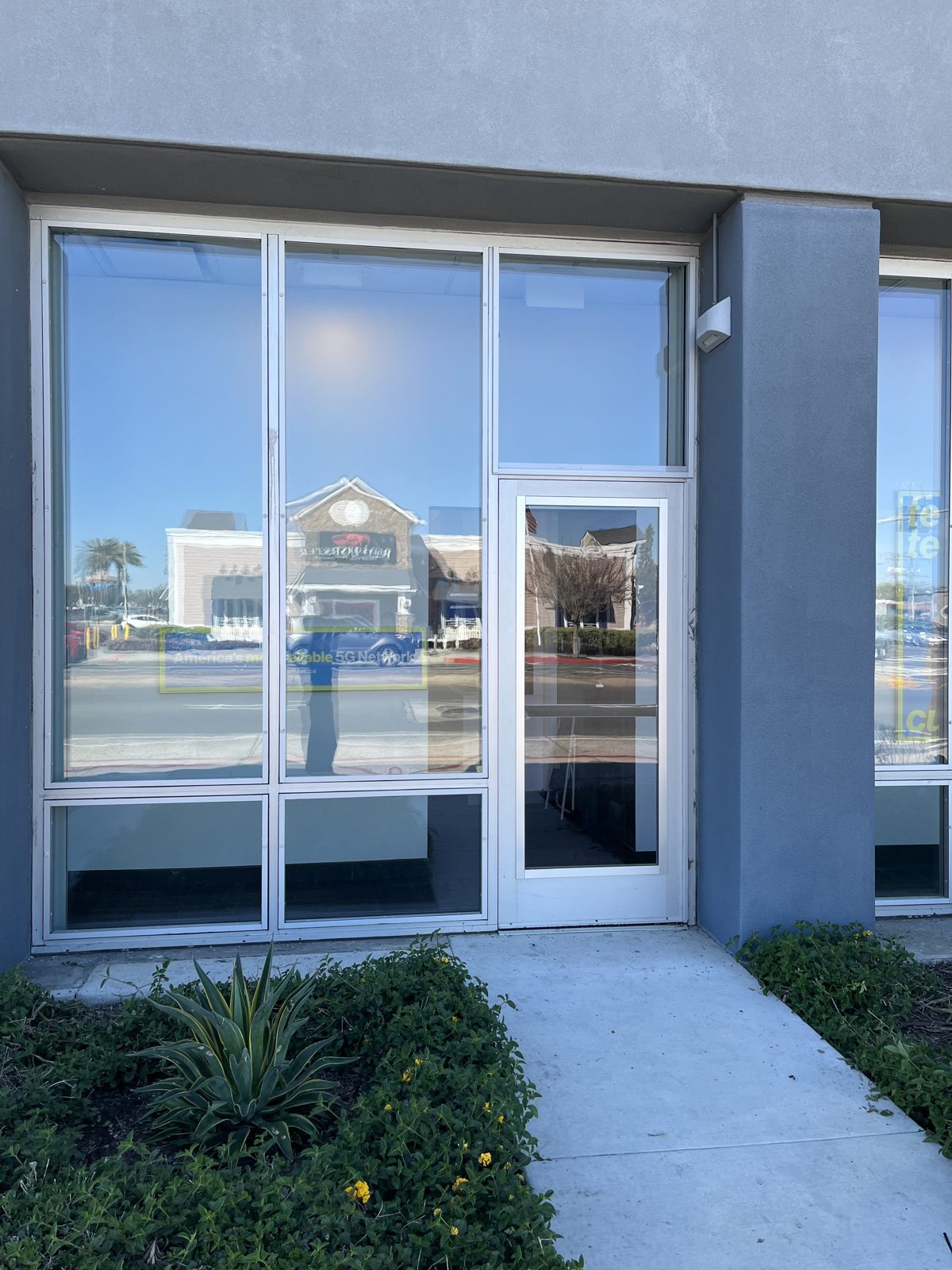 Retrofit security glazing installed over a retail storefront — Orange County